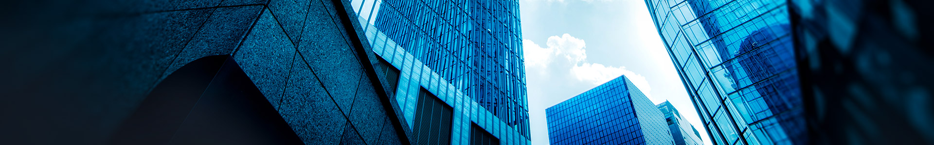 looking up at skyscrapers