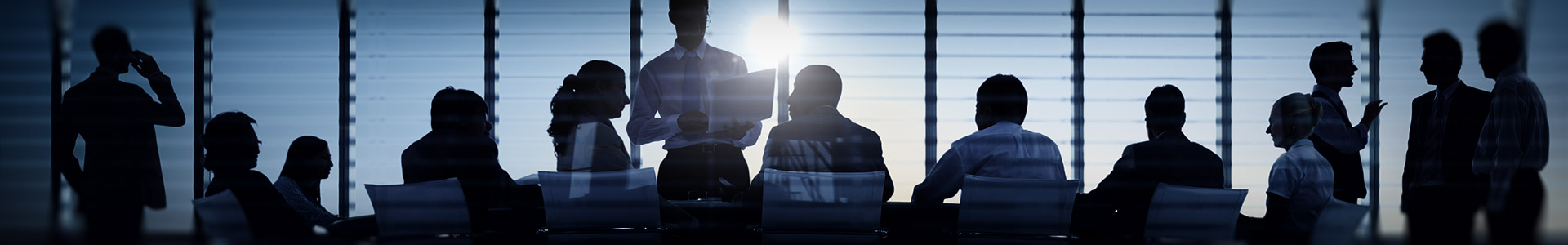 financial team having a meeting in a conference room in a high rise skyscraper